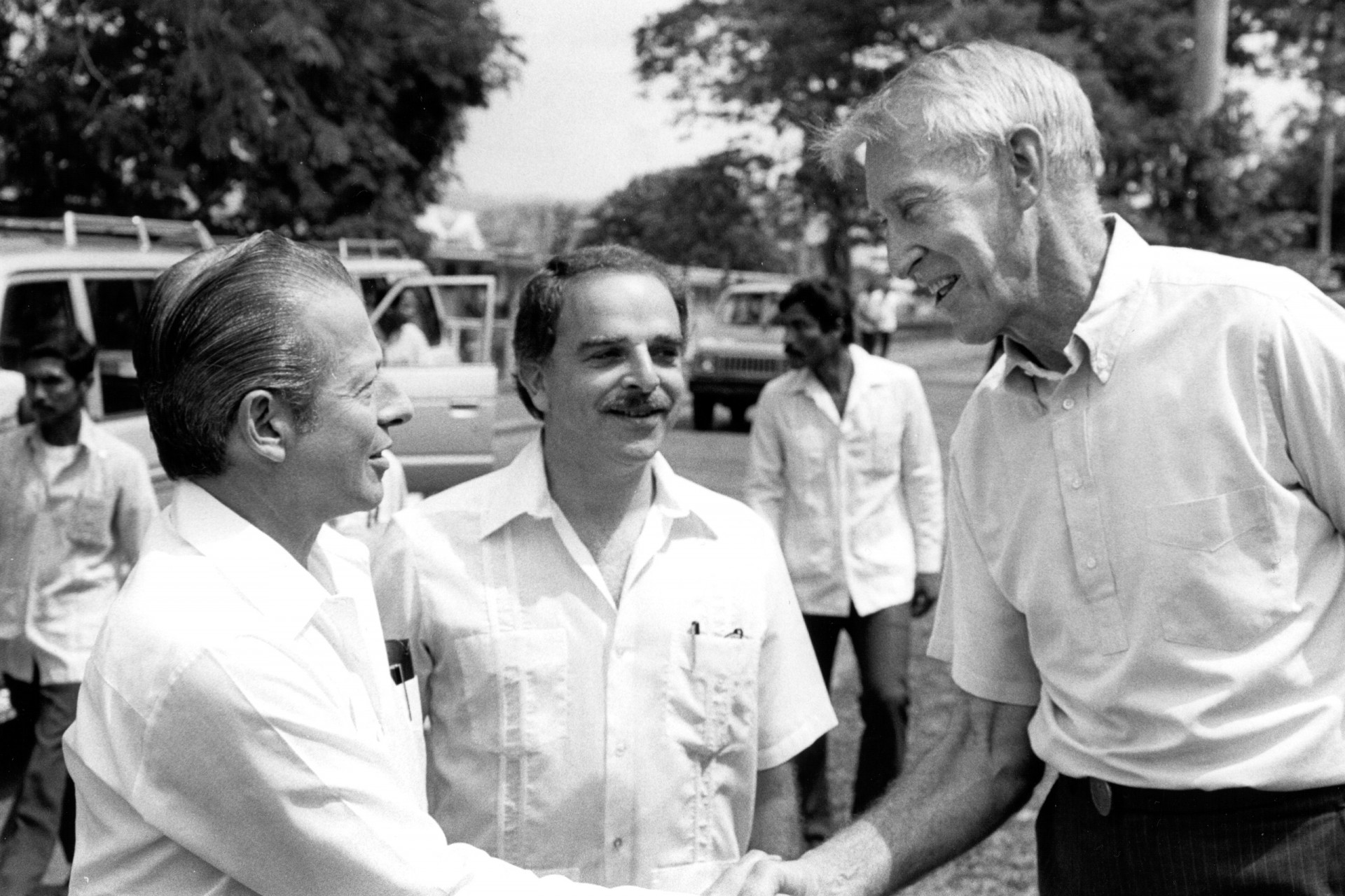 Panamanian President Eric Delvalle, left, greets Smithsonian’s special assistant in tropical biology